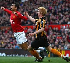 Penalty or dive? The referee has a split second to decide.