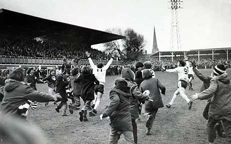 Radford wheels away to be mobbed by fans after his goal