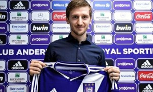 Marin holding up the Anderlecht shirt that he hopes to be wearing as he seeks to resurrect his career in Belgium. 